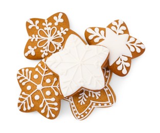 Photo of Tasty star shaped Christmas cookies with icing isolated on white, top view