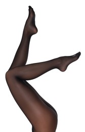 Photo of Woman with beautiful long legs wearing black tights on white background, closeup