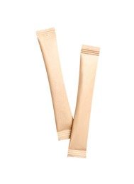 Photo of Beige sticks of sugar on white background, top view