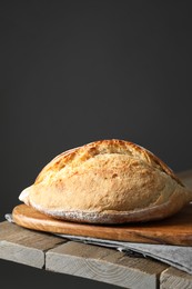 Freshly baked sourdough bread on wooden table