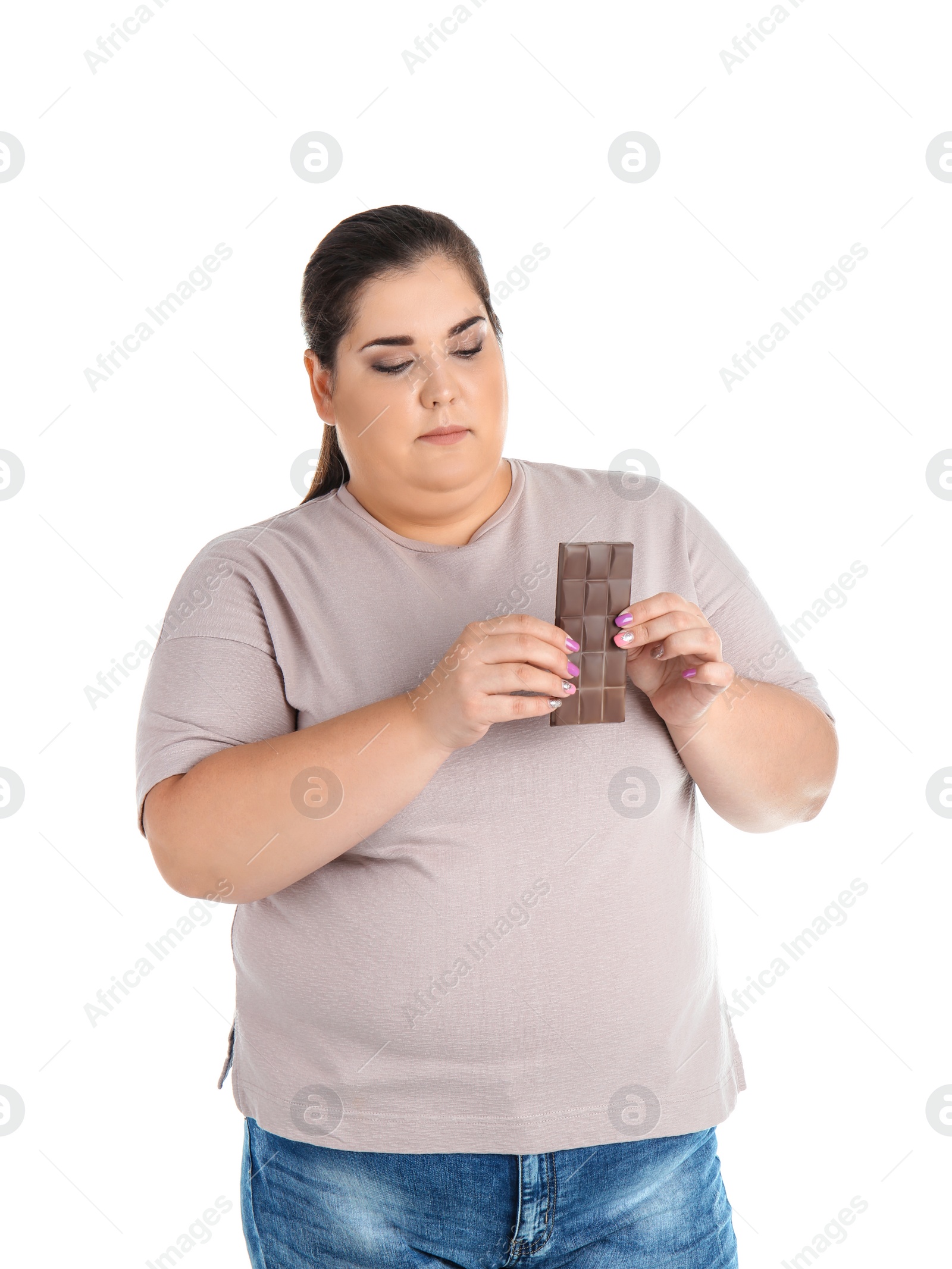 Photo of Overweight woman with chocolate bar on white background