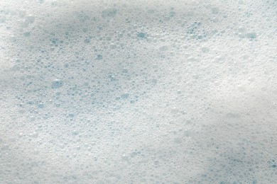 Photo of White washing foam as background, top view