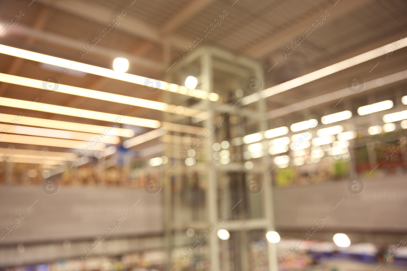 Photo of Blurred view of modern shopping mall interior