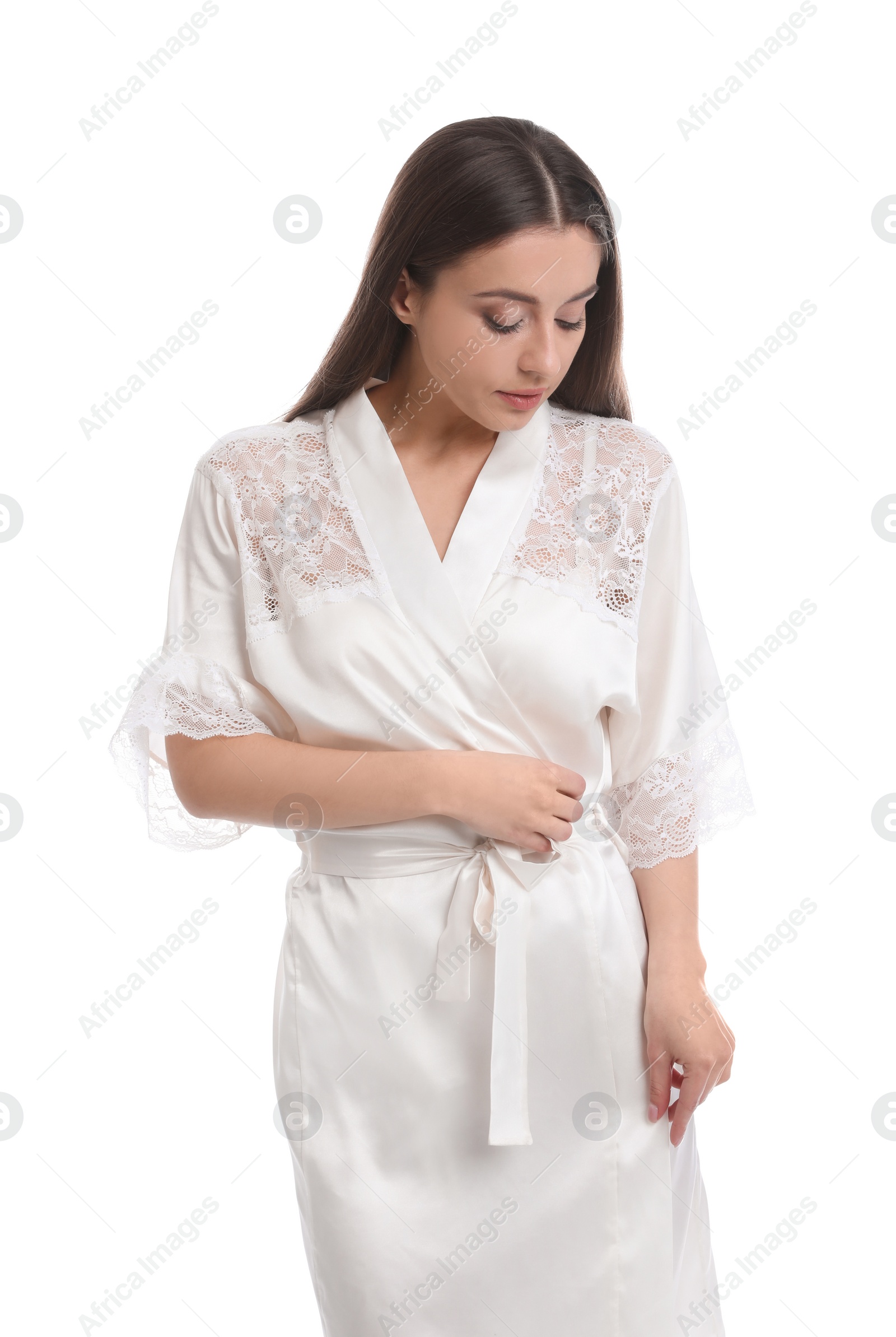 Photo of Young woman in silk robe on white background