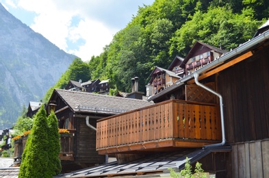 Picturesque view of town with beautiful buildings near mountains