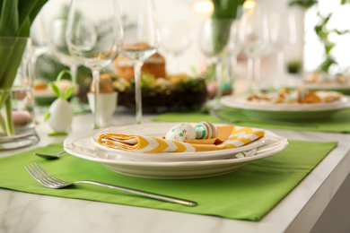 Festive Easter table setting with decorated eggs