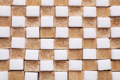 Photo of White and brown sugar cubes as background, top view