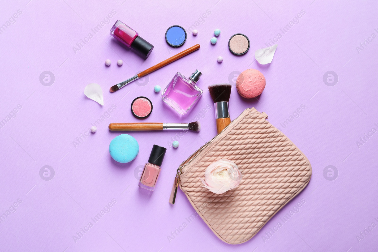 Photo of Makeup products with cosmetic bag on color background