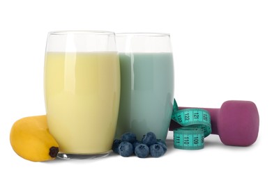 Photo of Tasty shakes, banana, blueberries, dumbbell and measuring tape isolated on white. Weight loss