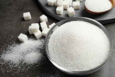 Composition with granulated sugar on grey table