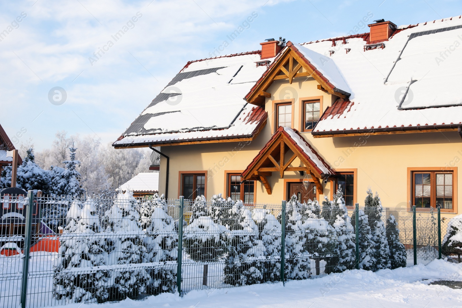 Photo of Winter landscape with modern house and trees in morning