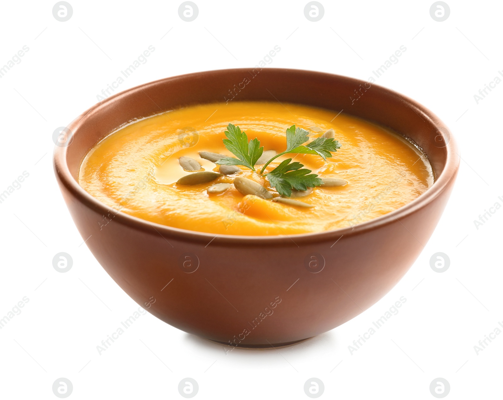 Photo of Delicious pumpkin cream soup in bowl on white background