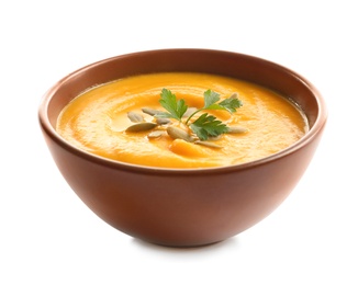 Photo of Delicious pumpkin cream soup in bowl on white background