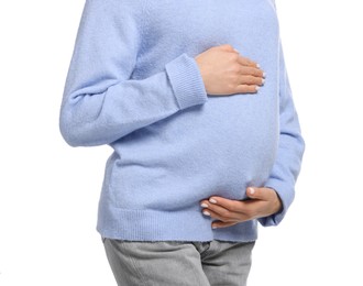 Photo of Pregnant woman touching her belly on white background, closeup