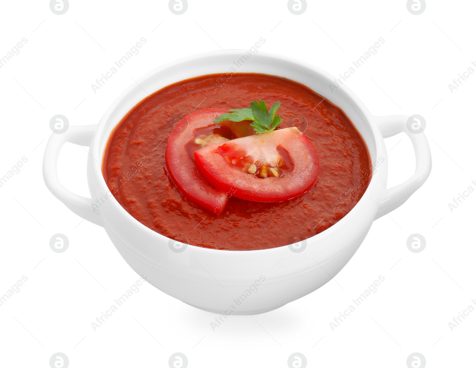 Photo of Delicious tomato cream soup in bowl isolated on white