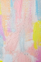 Photo of Strokes of different pastel acrylic paints on white canvas, closeup