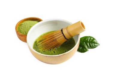 Photo of Cup of fresh matcha tea with bamboo whisk and green powder isolated on white