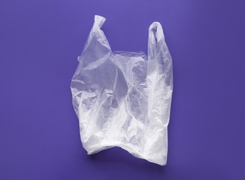 Clear disposable plastic bag on color background