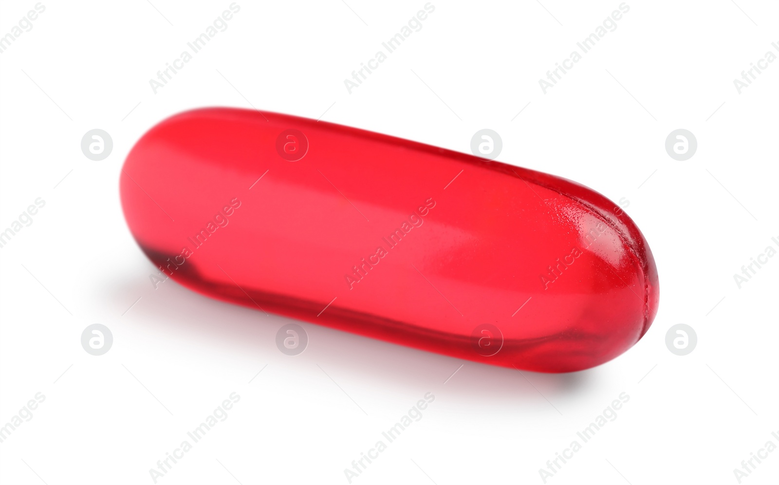 Photo of One red pill isolated on white. Medicinal treatment