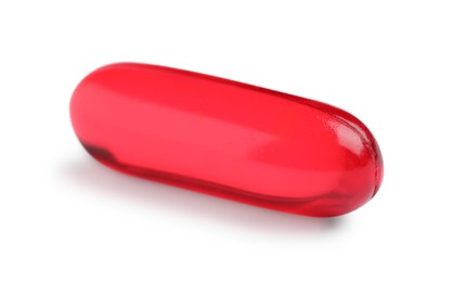 Photo of One red pill isolated on white. Medicinal treatment