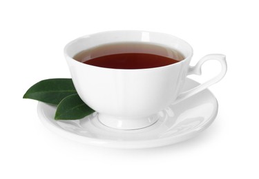 Photo of Aromatic tea in cup and green leaves isolated on white