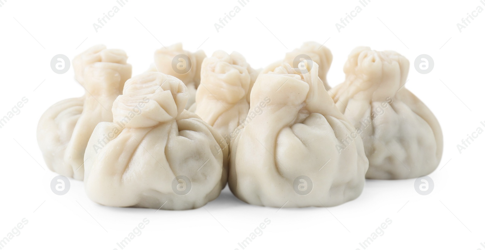 Photo of Many tasty khinkali (dumplings) isolated on white. Georgian cuisine