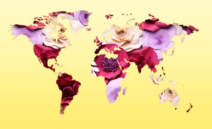 Image of World map made of beautiful flowers on yellow background, banner design