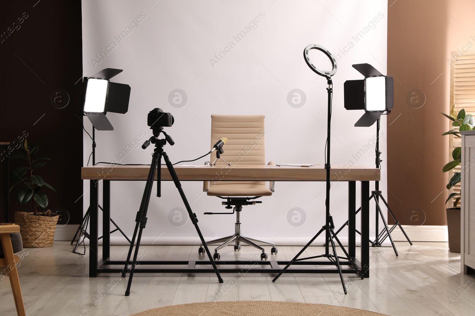 Photo of Modern blogger's workplace with professional equipment in room