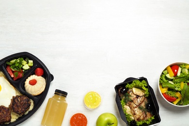 Photo of Flat lay composition with lunchboxes on white table, space for text. Healthy food delivery