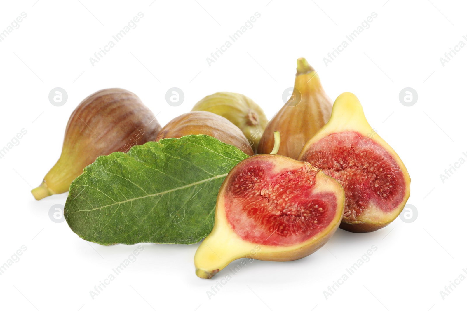 Photo of Tasty ripe figs and green leaf isolated on white