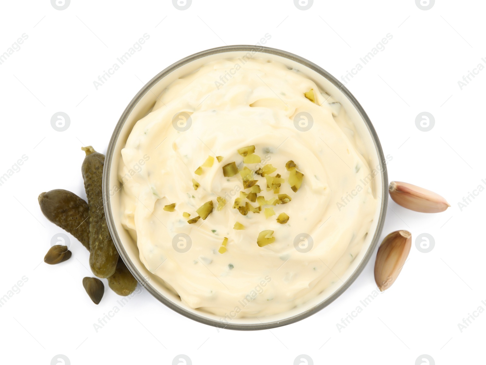 Photo of Tartar sauce and ingredients on white background, top view