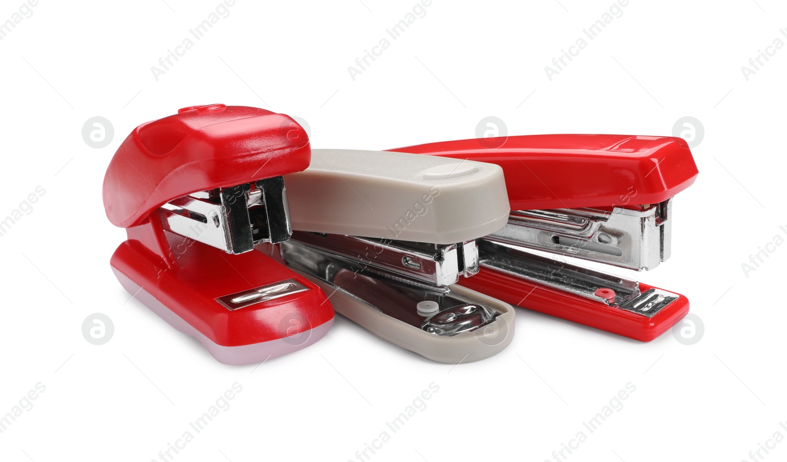 Photo of Many new bright staplers isolated on white