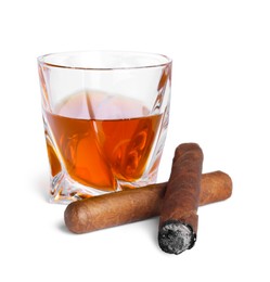 Photo of Glass of whiskey and cigars isolated on white