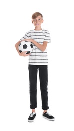 Photo of Portrait of young boy holding soccer ball on white background