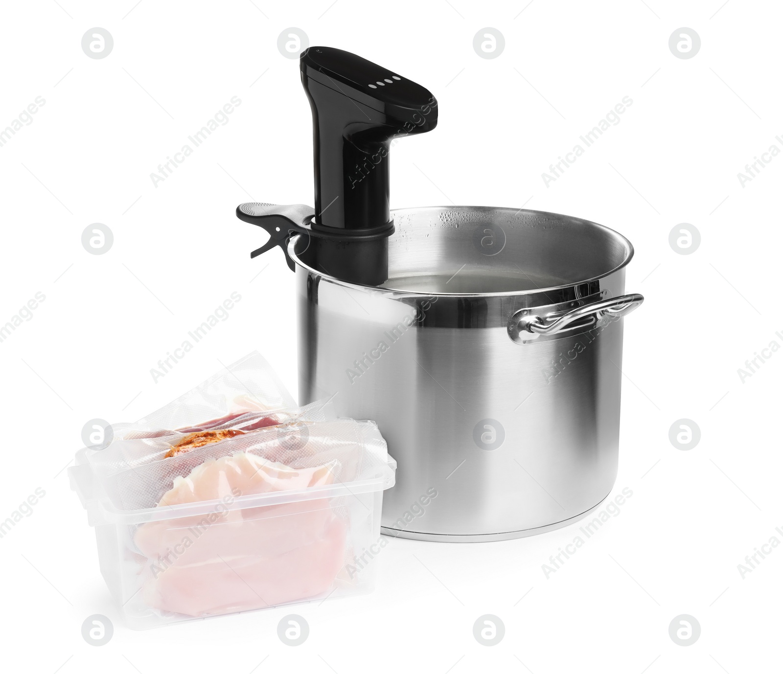 Photo of Thermal immersion circulator in pot and meat on white background. Vacuum packing for sous vide cooking