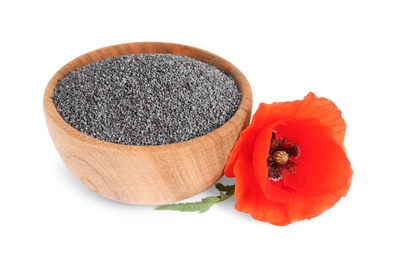 Photo of Wooden bowl of poppy seeds and flower isolated on white
