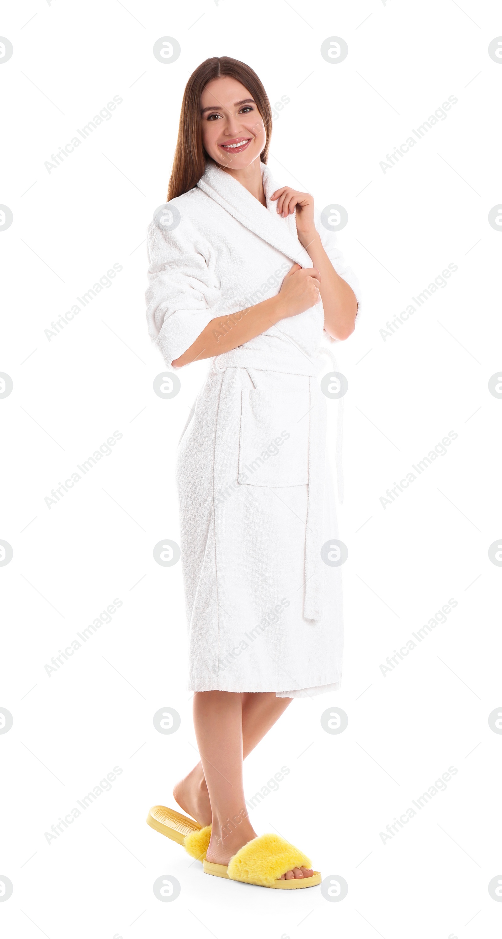 Photo of Young woman in bathrobe on white background