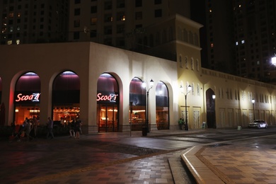 Photo of DUBAI, UNITED ARAB EMIRATES - NOVEMBER 03, 2018: Night cityscape with Scoozi restaurant