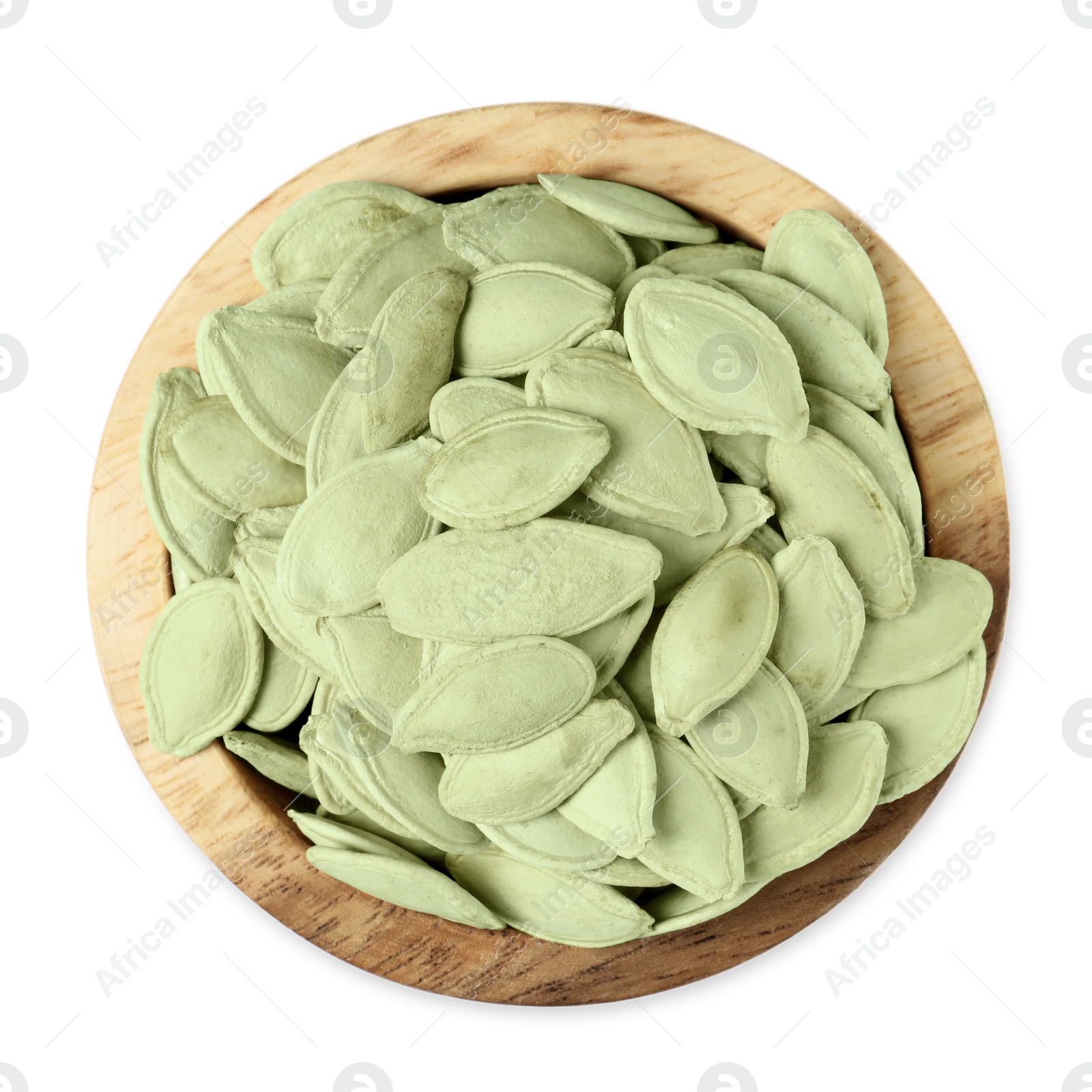 Photo of Wooden bowl with pumpkin seeds isolated on white, top view