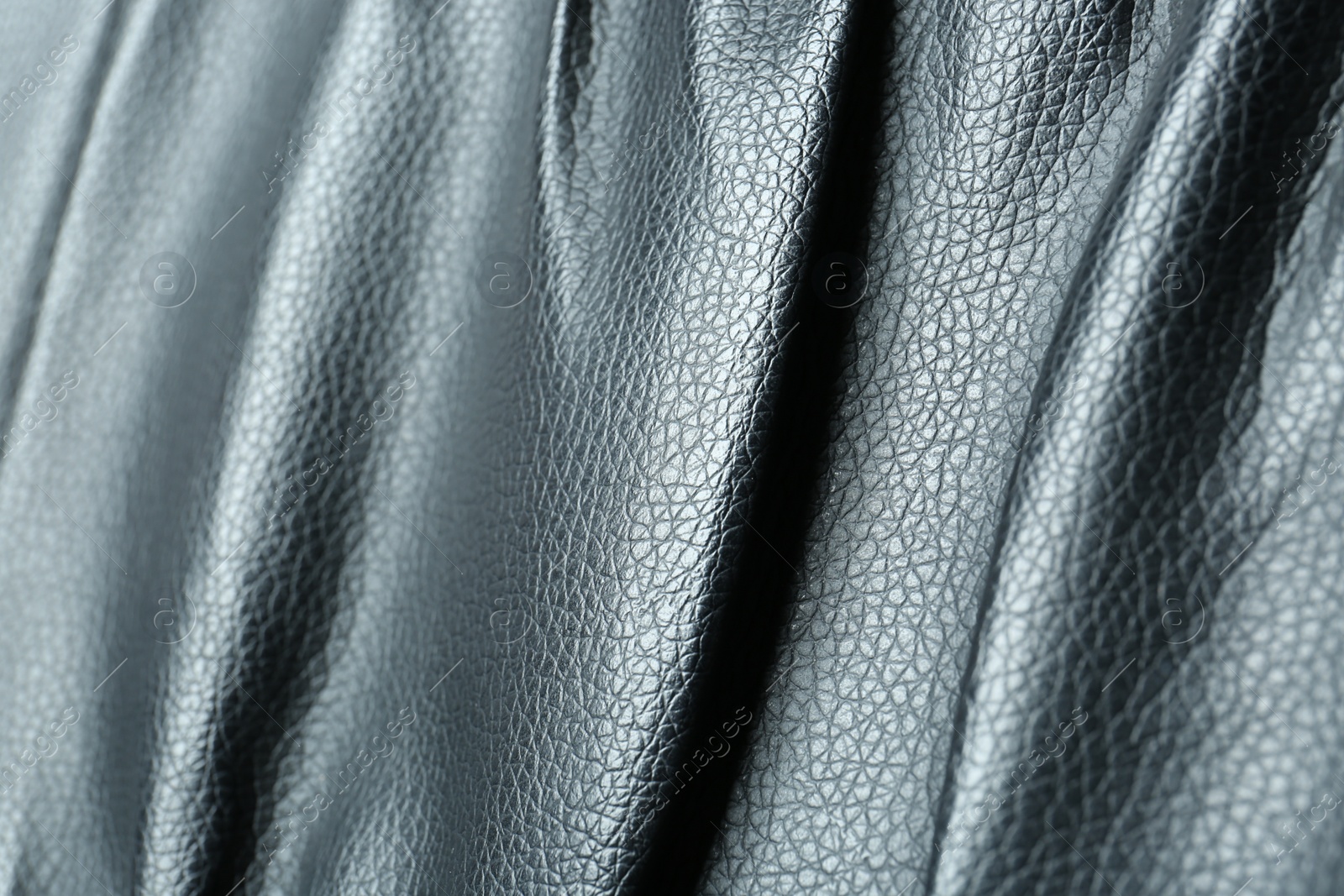 Photo of Black natural leather as background, closeup view