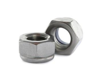 Two metal nyloc nuts on white background