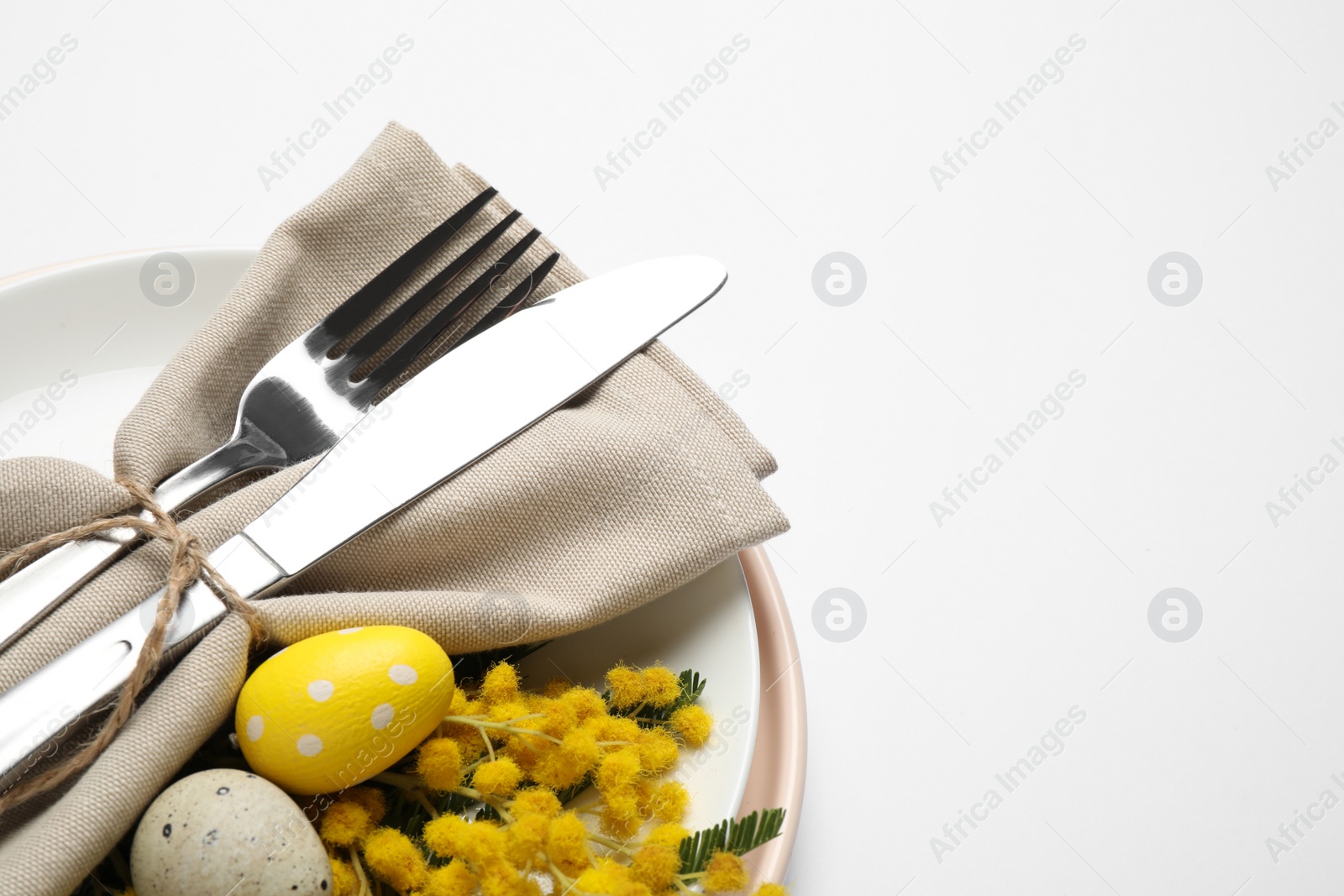 Photo of Festive Easter table setting with floral decor on white background, above view