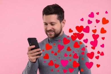 Image of Long distance love. Man chatting with sweetheart via smartphone on pink background. Hearts flying out of device