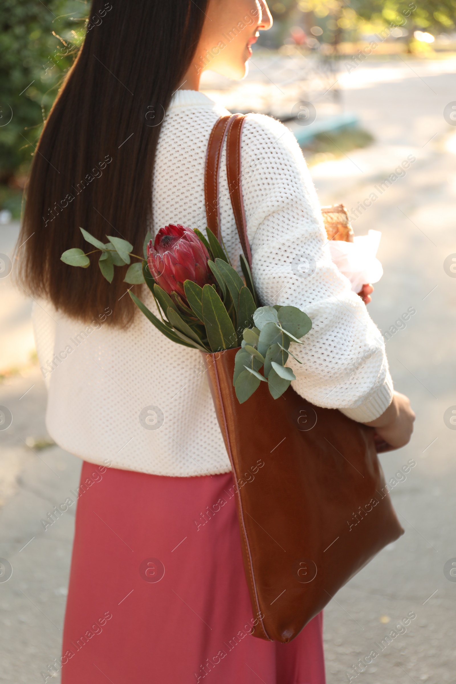 Photo of Woman with leather shopper bag outdoors, closeup