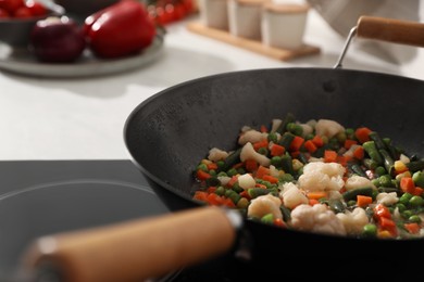 Photo of Frying pan with mix of fresh vegetables, closeup