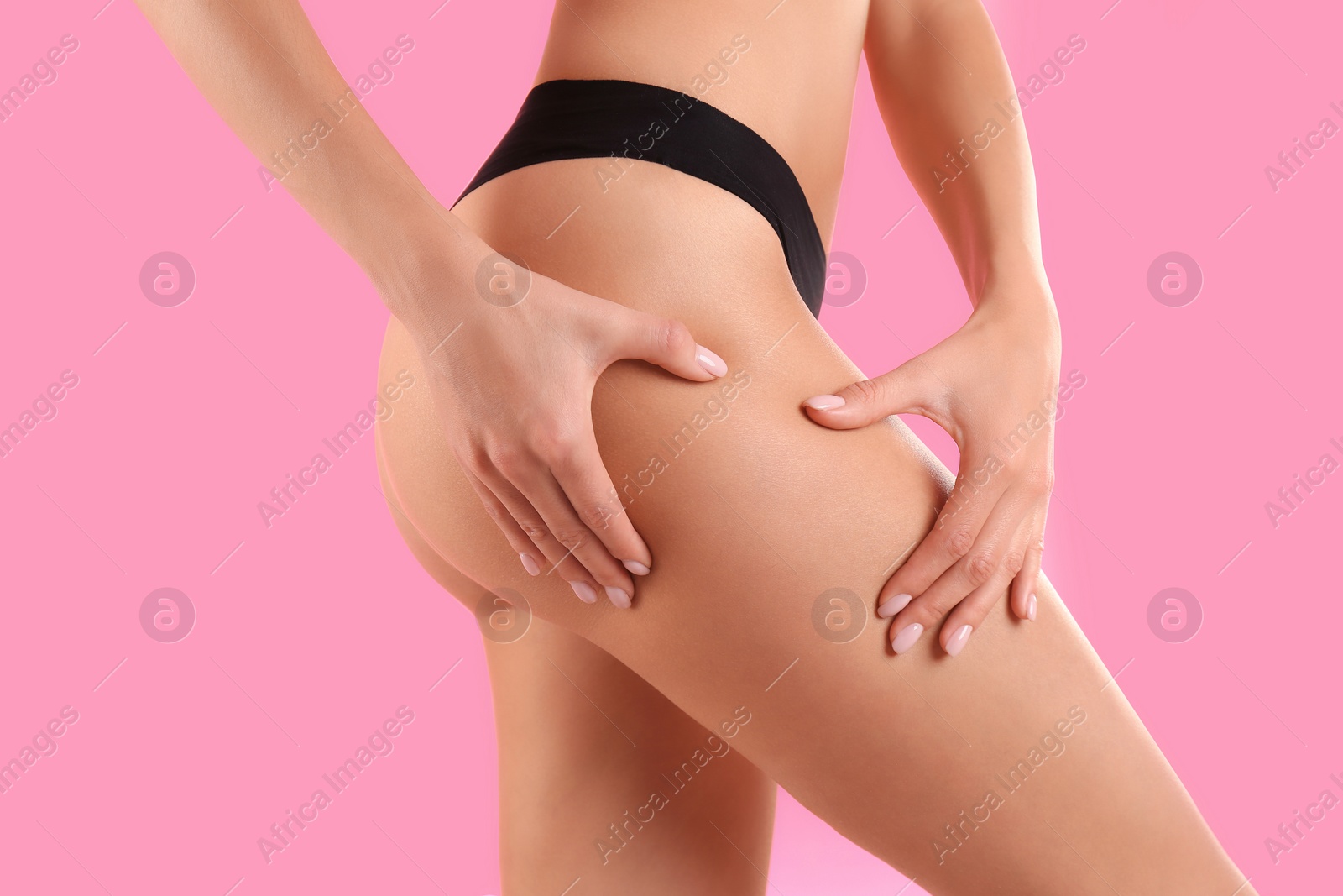 Photo of Closeup view of slim woman in underwear on color background. Cellulite problem concept