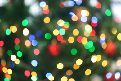 Photo of Blurred view of glowing Christmas lights as background. Festive mood