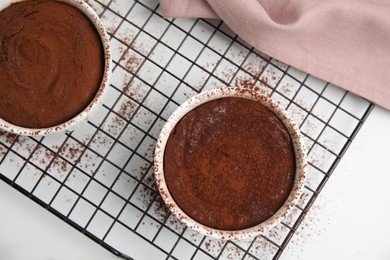 Photo of Delicious fresh chocolate fondant on white table, flat lay