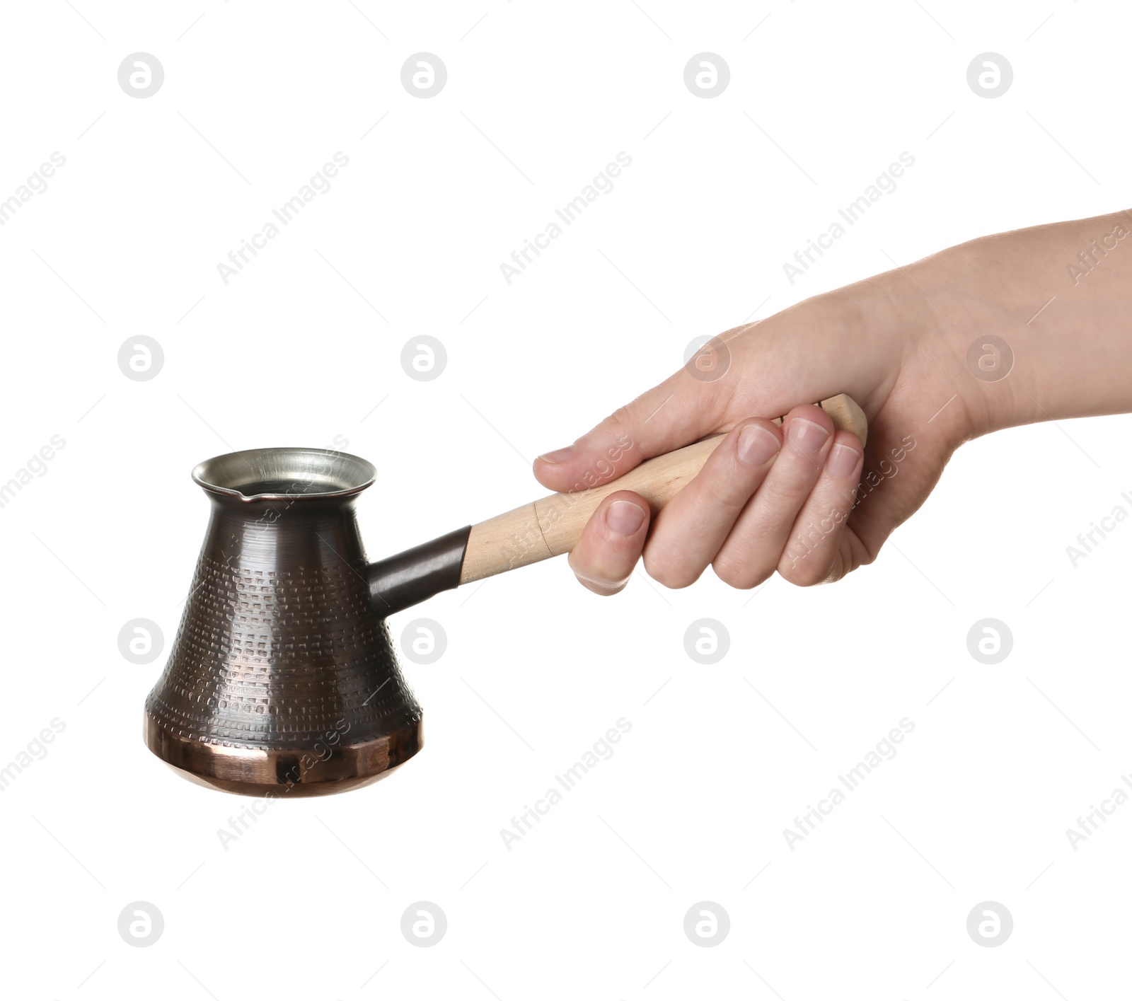 Photo of Woman holding copper turkish coffee pot on white background, closeup