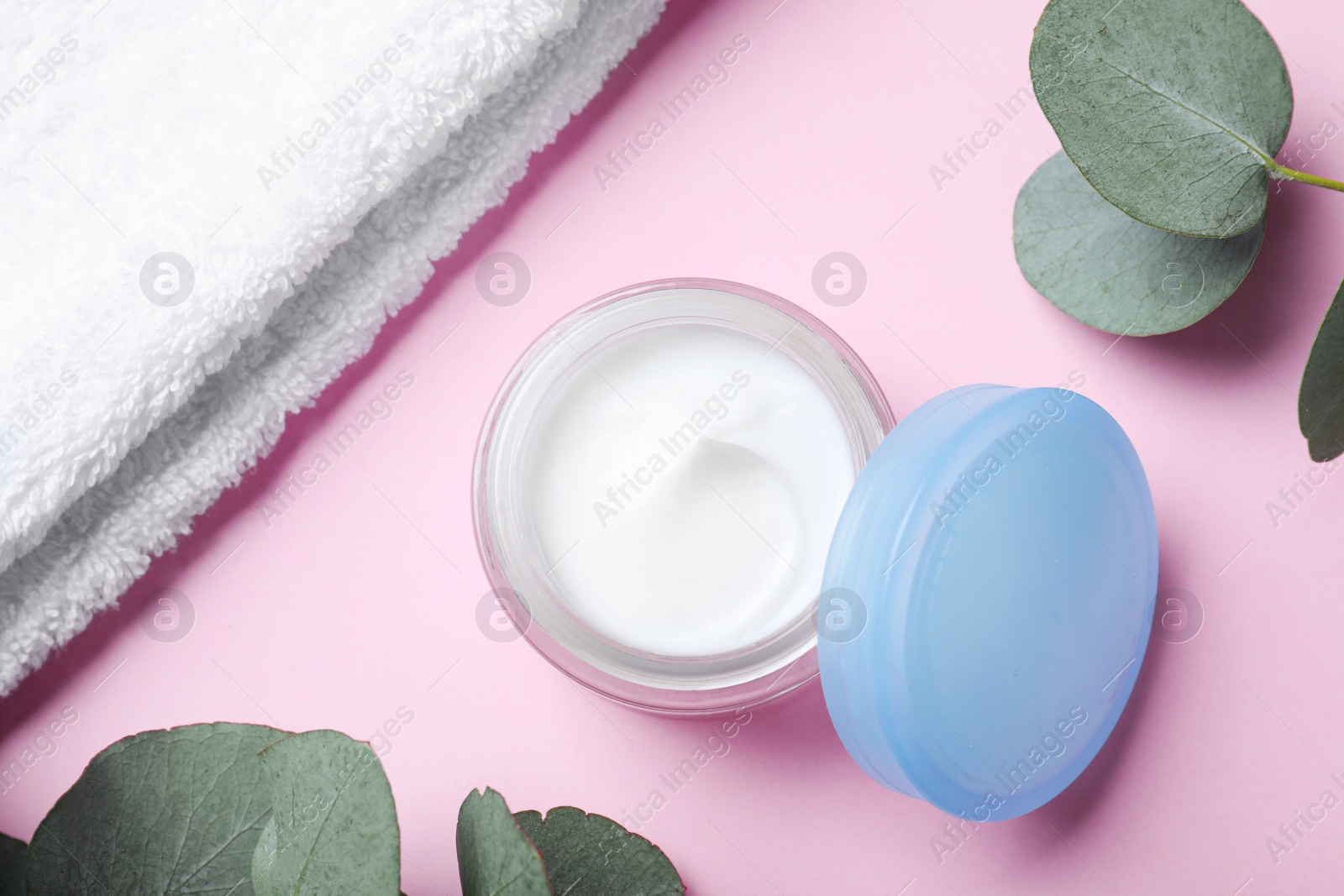 Photo of Flat lay composition with jar of cream on pink background